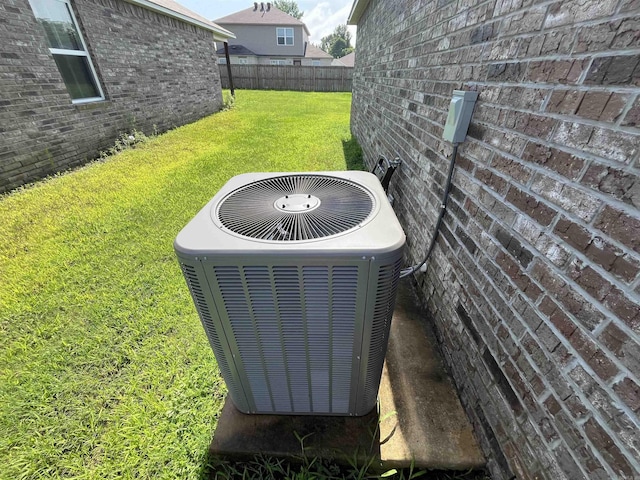 exterior view of a central AC unit and brick siding
