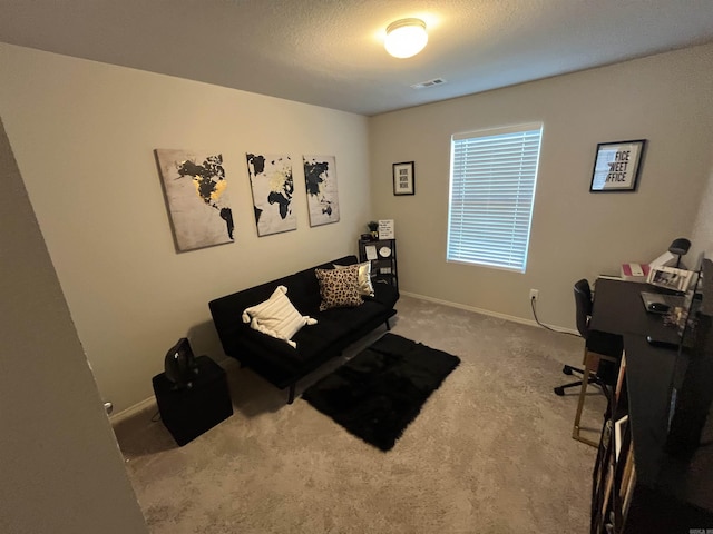 carpeted home office featuring baseboards