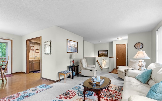 5 Torre Del Mar Way, Hot Springs Village, AR 71909 - living area with a textured ceiling and light wood-type flooring