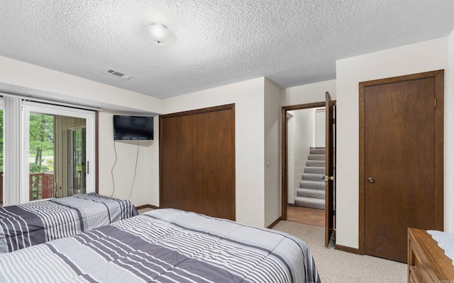 5 Torre Del Mar Way, Hot Springs Village, AR 71909 - bedroom featuring a closet, light carpet, and a textured ceiling