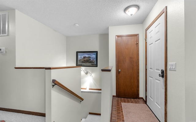 5 Torre Del Mar Way, Hot Springs Village, AR 71909 - hallway with an upstairs landing and a textured ceiling