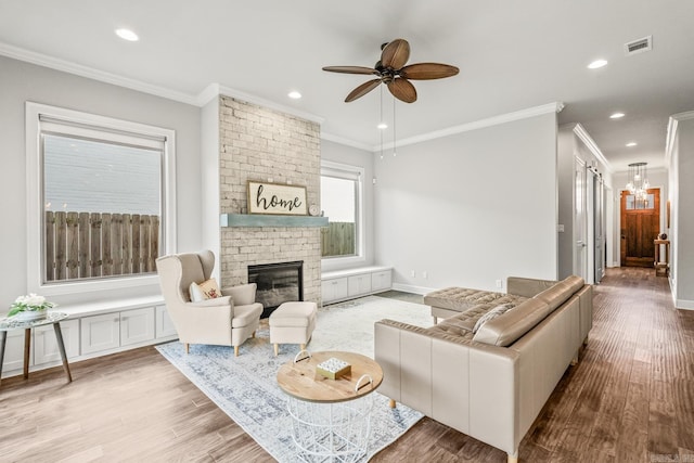 301 Kanis Ridge Dr, Little Rock, AR 72223 - living room featuring crown molding, a fireplace, a ceiling fan, wood finished floors, and recessed lighting