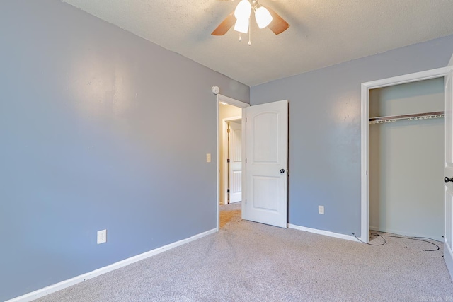 1304 Dupwe Dr, Jonesboro, AR 72401 - unfurnished bedroom featuring carpet, a closet, a ceiling fan, and a textured ceiling