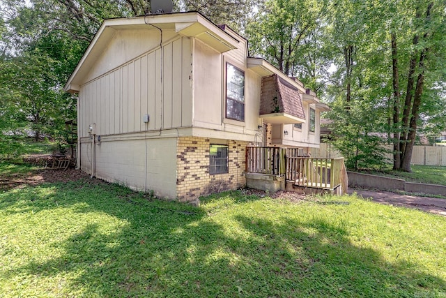 1304 Dupwe Dr, Jonesboro, AR 72401 - view of side of home featuring a lawn and brick siding