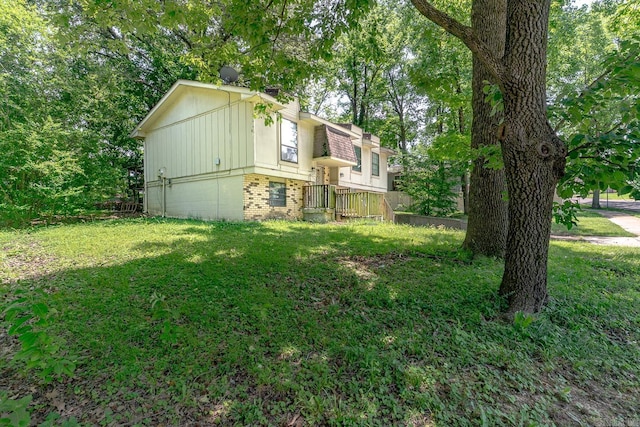 1304 Dupwe Dr, Jonesboro, AR 72401 - view of side of property with brick siding and a lawn