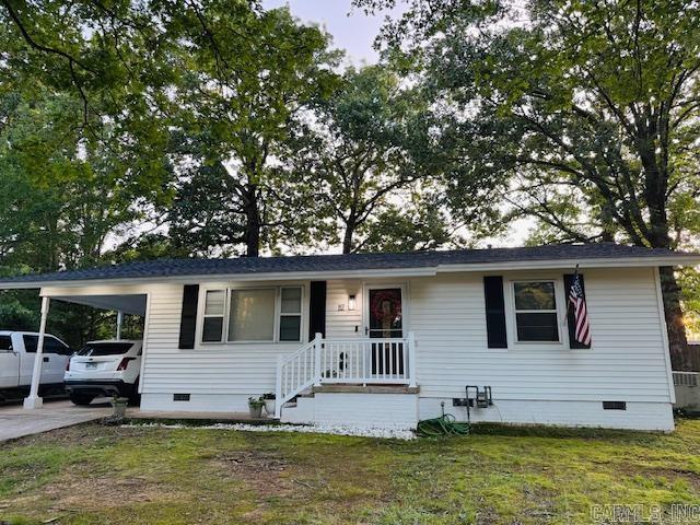 117 S Briarwood, Sheridan, AR 72150 - view of front of home with crawl space, an attached carport, and a front yard