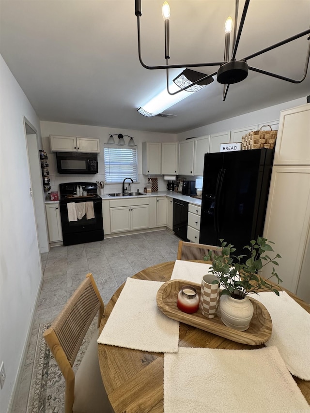 117 S Briarwood, Sheridan, AR 72150 - kitchen with black appliances, a ceiling fan, and light countertops