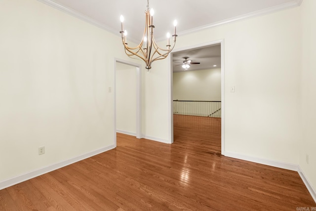 2219 Westport Loop, Little Rock, AR 72212 - spare room featuring a chandelier, ornamental molding, wood finished floors, and ceiling fan