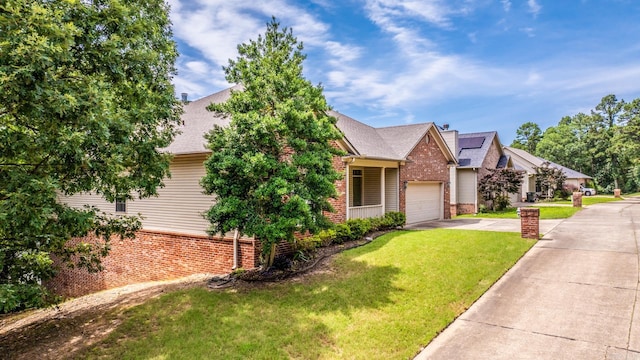 2219 Westport Loop, Little Rock, AR 72212 - view of front facade with brick siding, concrete driveway, a garage, a front lawn, and roof with shingles