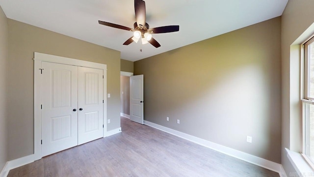 56 Blair, Vilonia, AR 72173 - unfurnished bedroom featuring light wood-style flooring, a closet, and ceiling fan