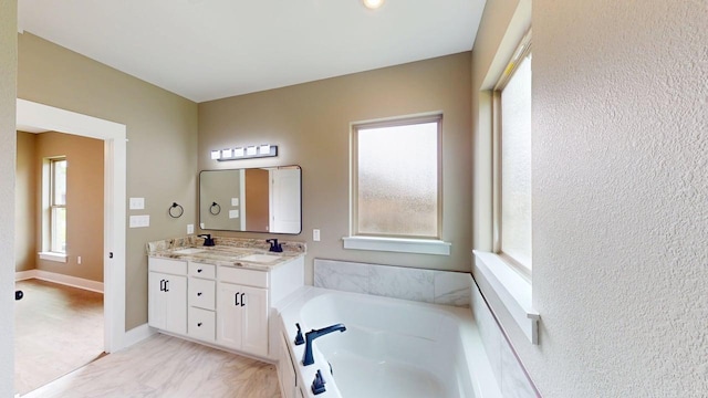 56 Blair, Vilonia, AR 72173 - bathroom featuring double vanity and a bath