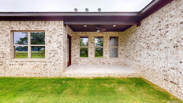 56 Blair, Vilonia, AR 72173 - entrance to property with brick siding and a ceiling fan