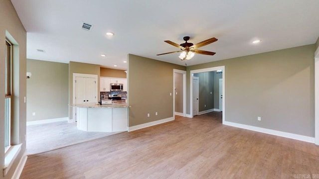 56 Blair, Vilonia, AR 72173 - unfurnished living room with ceiling fan, light wood-type flooring, and recessed lighting