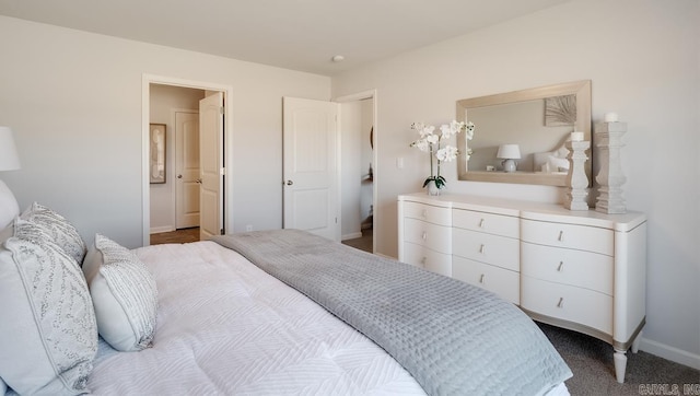 bedroom featuring baseboards