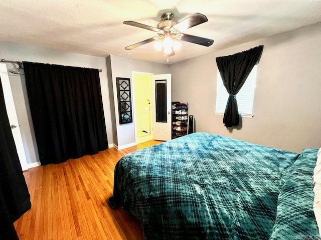 6312 Sandy Ln, Little Rock, AR 72204 - bedroom with wood finished floors and a ceiling fan