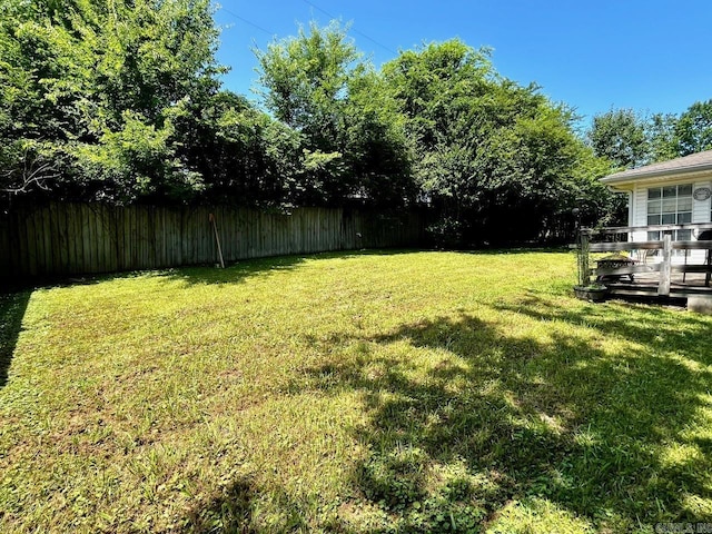6312 Sandy Ln, Little Rock, AR 72204 - fenced backyard featuring a wooden deck