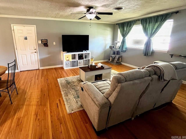 6312 Sandy Ln, Little Rock, AR 72204 - living area with a ceiling fan, crown molding, wood finished floors, and a textured ceiling
