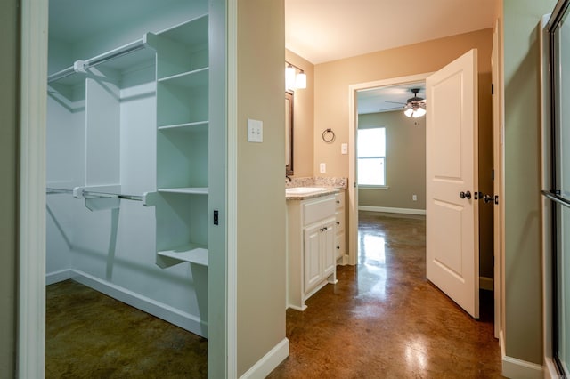 2702 Gage Dr, Benton, AR 72019 - full bath featuring a ceiling fan, vanity, finished concrete floors, and a shower