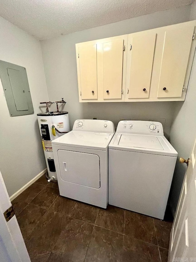laundry area with electric panel, electric water heater, cabinet space, washing machine and dryer, and a textured ceiling