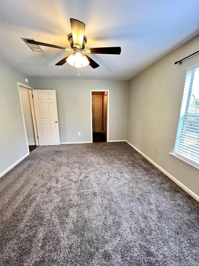 unfurnished bedroom with carpet and ceiling fan
