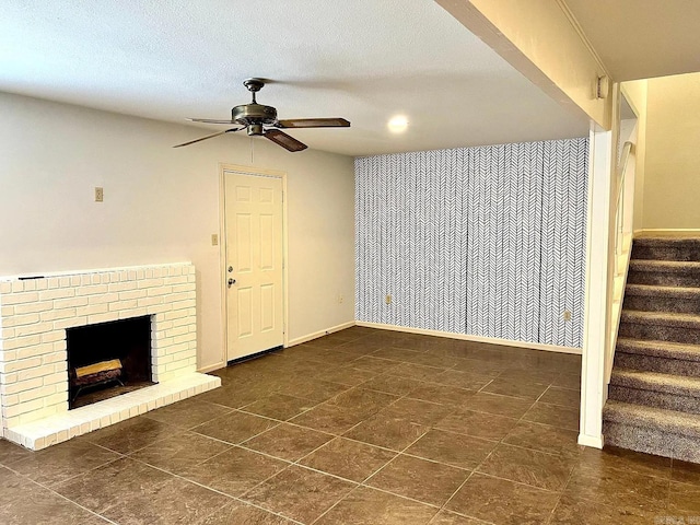 unfurnished living room with a ceiling fan, stairway, a fireplace, tile patterned flooring, and recessed lighting
