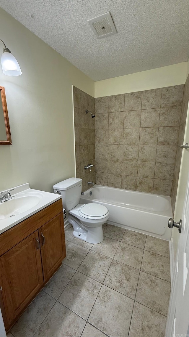3003 Vancouver Dr, Little Rock, AR 72204 - bathroom featuring vanity, a textured ceiling, shower / bathtub combination, and tile patterned floors