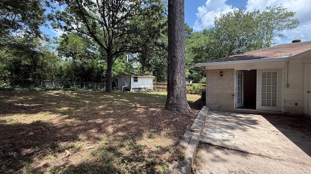 3003 Vancouver Dr, Little Rock, AR 72204 - view of yard with a shed and a patio area