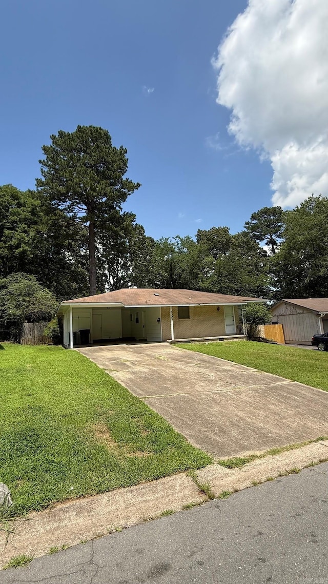 3003 Vancouver Dr, Little Rock, AR 72204 - ranch-style home featuring driveway, a front yard, and a carport