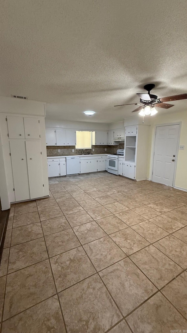 3003 Vancouver Dr, Little Rock, AR 72204 - kitchen featuring white appliances, a textured ceiling, white cabinets, light tile patterned floors, and ceiling fan