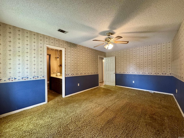 701 Emerald Gardens Dr, North Little Rock, AR 72118 - empty room with a ceiling fan, carpet floors, a textured ceiling, and wallpapered walls