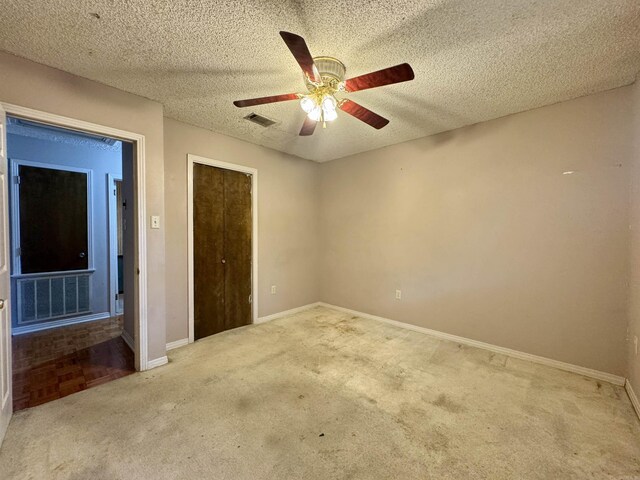 701 Emerald Gardens Dr, North Little Rock, AR 72118 - unfurnished bedroom with carpet floors, ceiling fan, a textured ceiling, and a closet