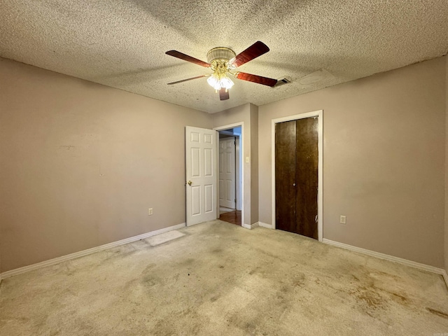 701 Emerald Gardens Dr, North Little Rock, AR 72118 - unfurnished bedroom with carpet flooring, a closet, ceiling fan, and a textured ceiling