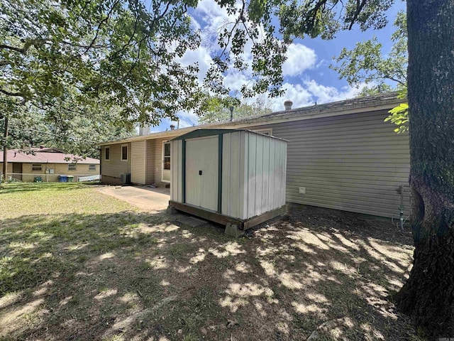 701 Emerald Gardens Dr, North Little Rock, AR 72118 - rear view of property with a storage shed, a yard, and crawl space