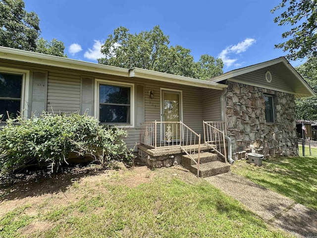 701 Emerald Gardens Dr, North Little Rock, AR 72118 - single story home featuring a front lawn and stone siding