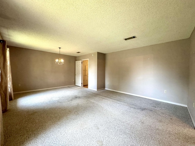 701 Emerald Gardens Dr, North Little Rock, AR 72118 - spare room featuring a chandelier, carpet floors, and a textured ceiling