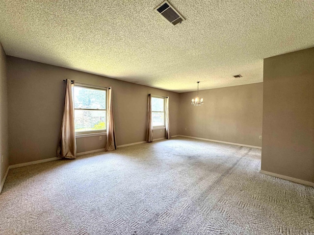 701 Emerald Gardens Dr, North Little Rock, AR 72118 - unfurnished room with a chandelier, a textured ceiling, and carpet