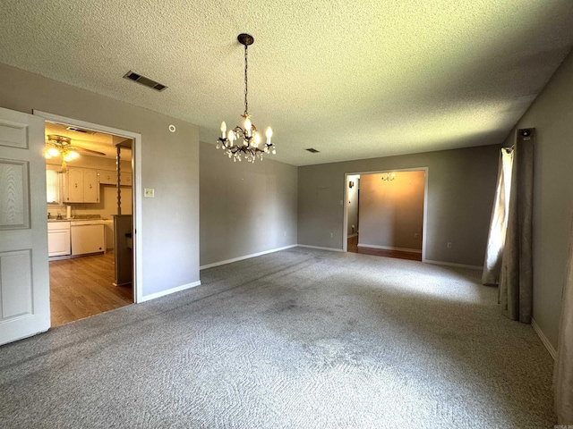 701 Emerald Gardens Dr, North Little Rock, AR 72118 - carpeted empty room with a chandelier and a textured ceiling