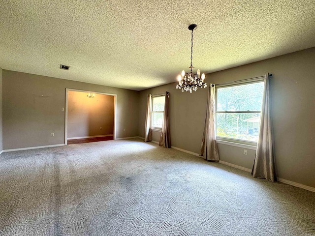 701 Emerald Gardens Dr, North Little Rock, AR 72118 - carpeted empty room with a chandelier and a textured ceiling