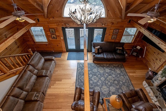 1415 Lakeshore, Hot Springs, AR 71913 - living area featuring a ceiling fan, wooden walls, hardwood / wood-style floors, healthy amount of natural light, and beam ceiling