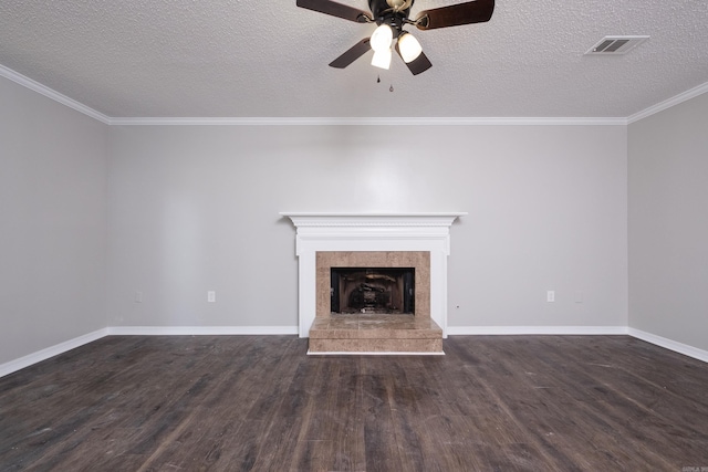 311 Nix Rd, Little Rock, AR 72211 - unfurnished living room featuring a ceiling fan, wood finished floors, a textured ceiling, crown molding, and a tiled fireplace