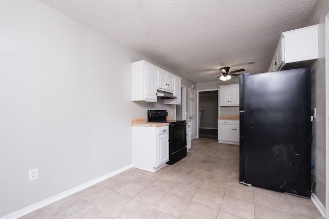 311 Nix Rd, Little Rock, AR 72211 - kitchen with black appliances, under cabinet range hood, ceiling fan, a textured ceiling, and light countertops