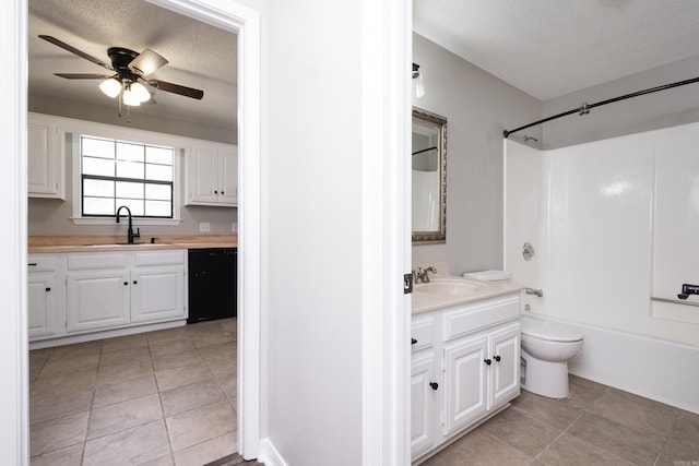 311 Nix Rd, Little Rock, AR 72211 - full bath featuring ceiling fan, vanity, shower / bathtub combination, tile patterned flooring, and a textured ceiling