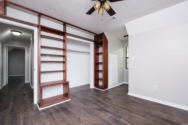 311 Nix Rd, Little Rock, AR 72211 - unfurnished bedroom with dark wood-type flooring, a textured ceiling, a closet, and ceiling fan