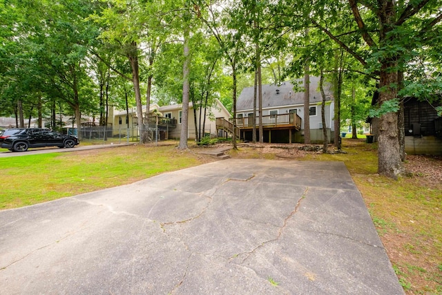 311 Nix Rd, Little Rock, AR 72211 - view of front facade with a front yard, a wooden deck, and stairs