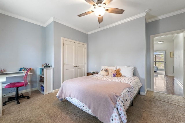 109 Sandstone Cv, Sherwood, AR 72120 - carpeted bedroom with crown molding, a closet, and a ceiling fan
