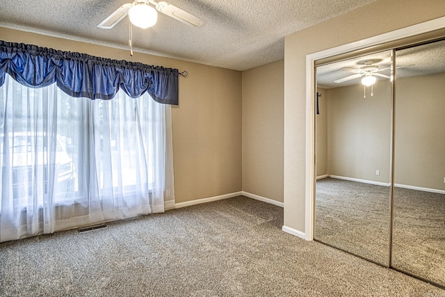 1 Halcon Pl, Hot Springs Village, AR 71909 - unfurnished bedroom with carpet flooring, a textured ceiling, a closet, and a ceiling fan