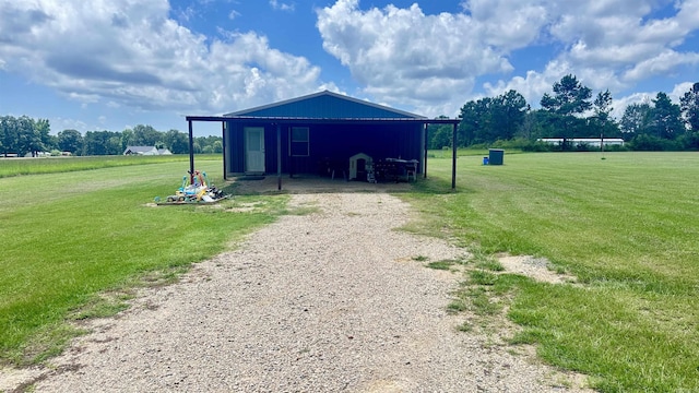 6273 Mc, Fouke, AR 71837 - view of pole building featuring a lawn, gravel driveway, and a carport