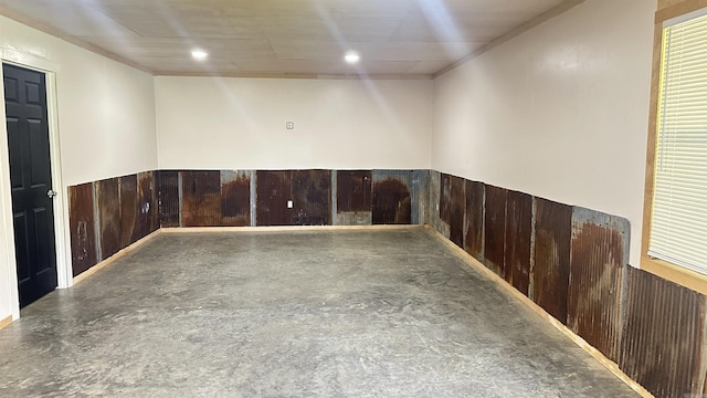 6273 Mc, Fouke, AR 71837 - empty room with a wainscoted wall, wood walls, ornamental molding, and concrete floors
