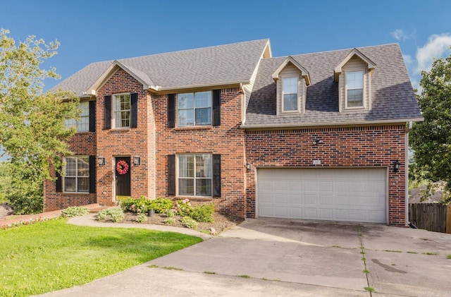 15 Rocky Crest Ct, Little Rock, AR 72211 - view of front of property featuring driveway, brick siding, an attached garage, and roof with shingles