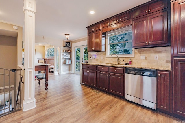 15 Rocky Crest Ct, Little Rock, AR 72211 - kitchen with stainless steel dishwasher, ornate columns, arched walkways, decorative backsplash, and crown molding